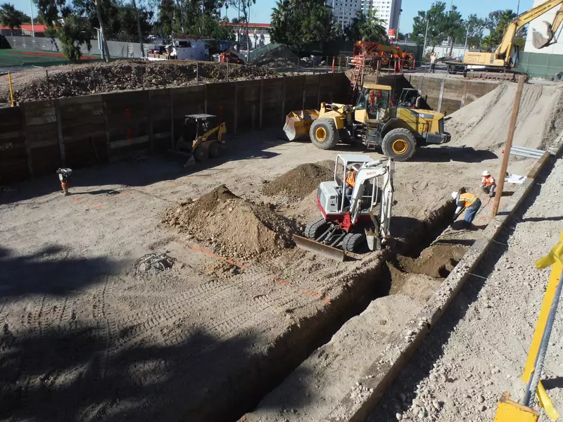 Whillock Contracting excavating a basement hole at San Diego State University.